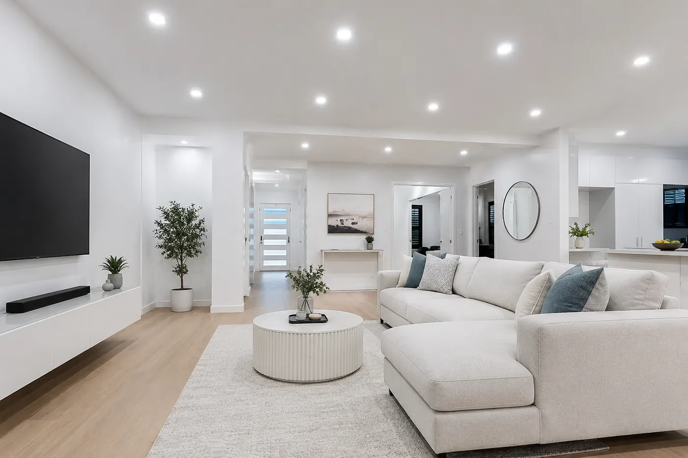 Open-plan living room lit with LED downlights