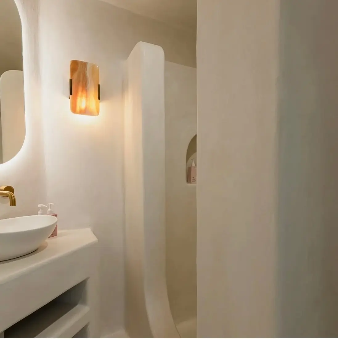Hidden cove LED strip lighting in an arched lounge