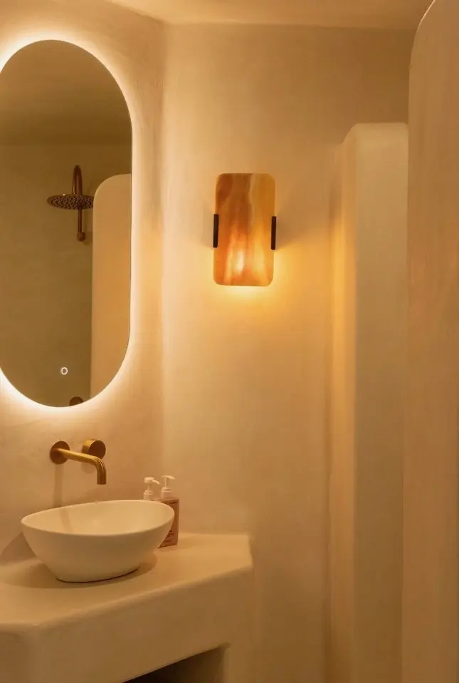 Bathroom wall sconce and backlit mirror